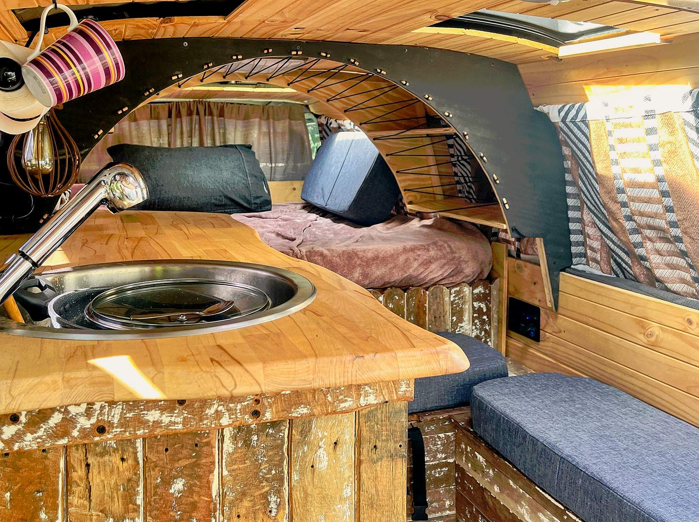 Kitchen bench — timber top, sink, and cooktop