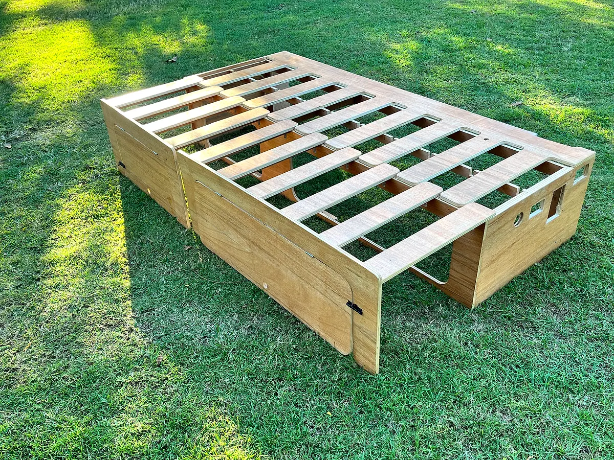 Comb bed extended — front view showing side hatch cutouts