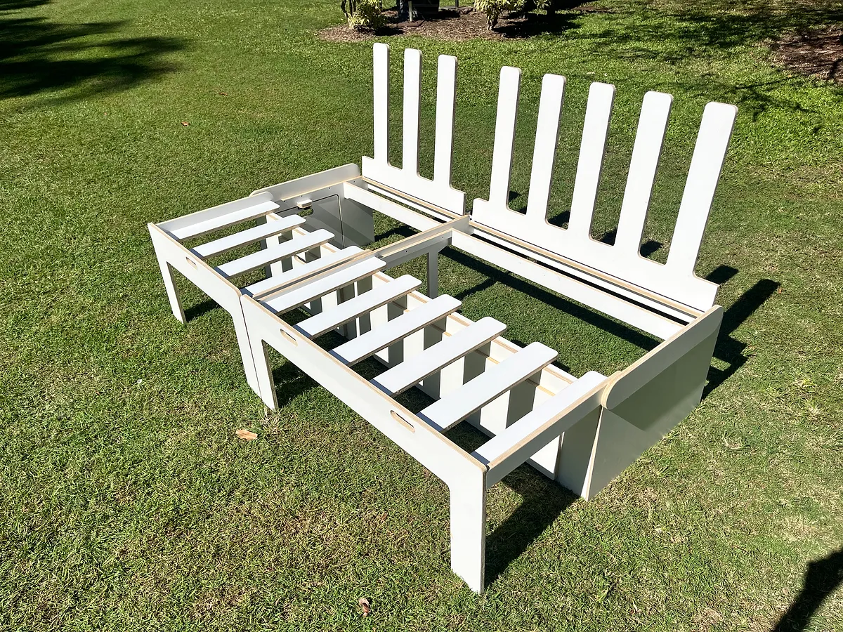 White comb bed in daybed mode — back panels upright