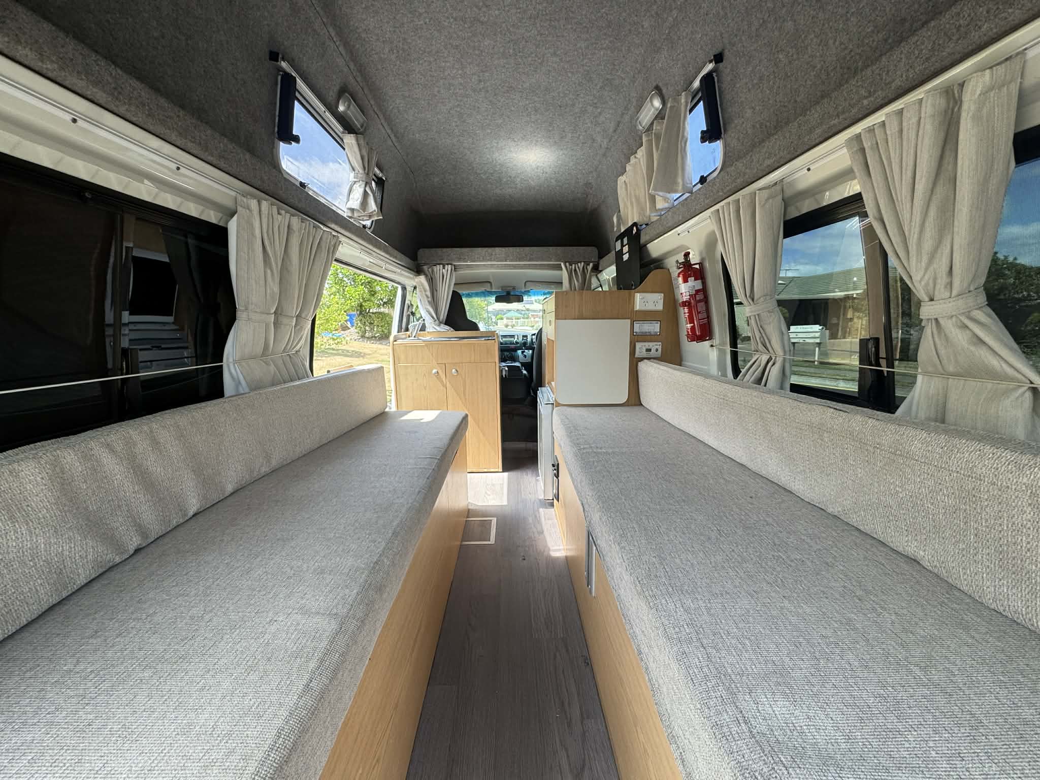 Hitop Hiace interior — twin benches, plenty of space