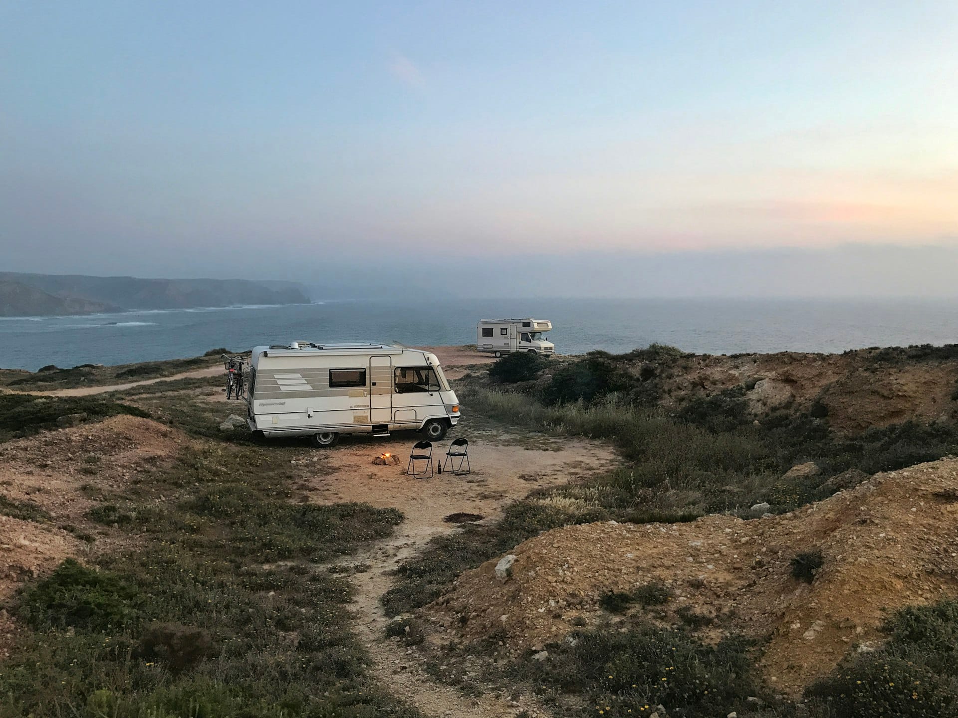 Campervan in a winter field under clear southern Queensland sky